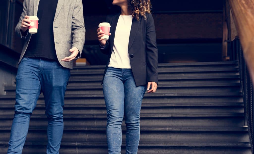 casually dressed couple walking 