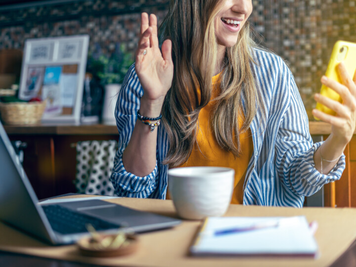 happy woman looking at phone