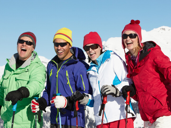 group of middle aged couples skiing