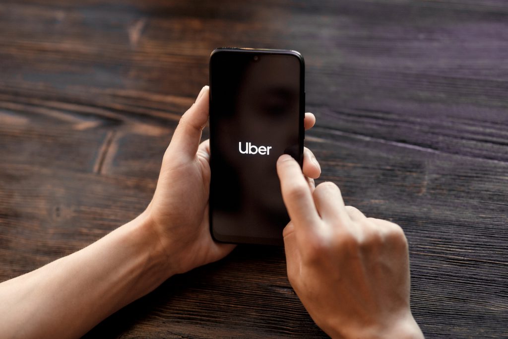 mobile phone opening Uber app