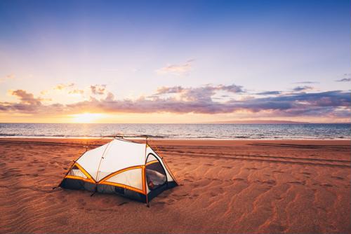 camping at the beach in a tent
