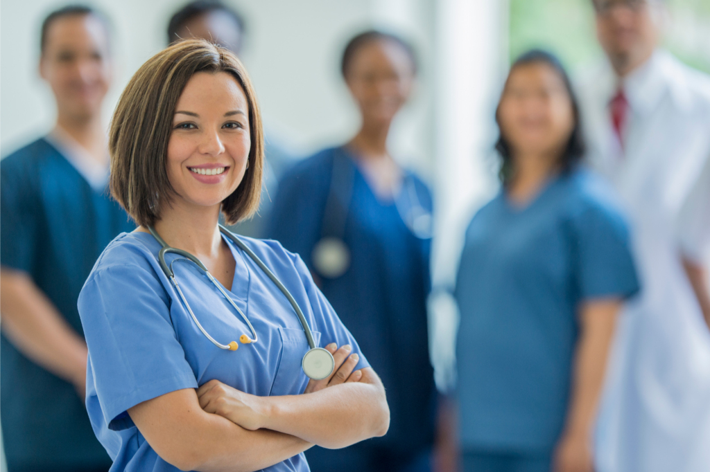smiling nurse with arms crossed