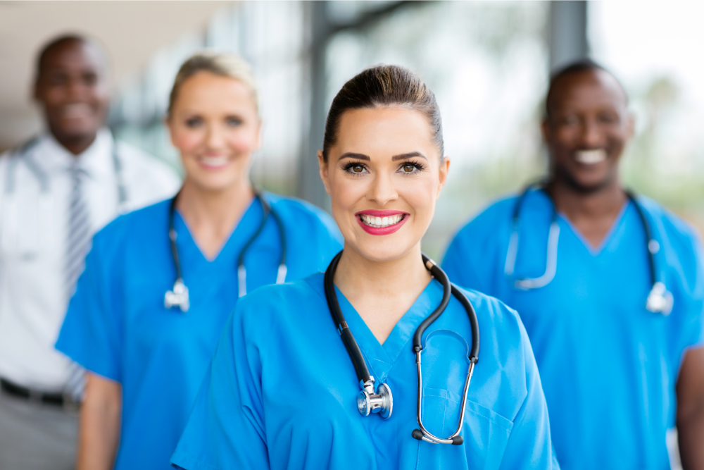 smiling nurse with stethoscope around neck