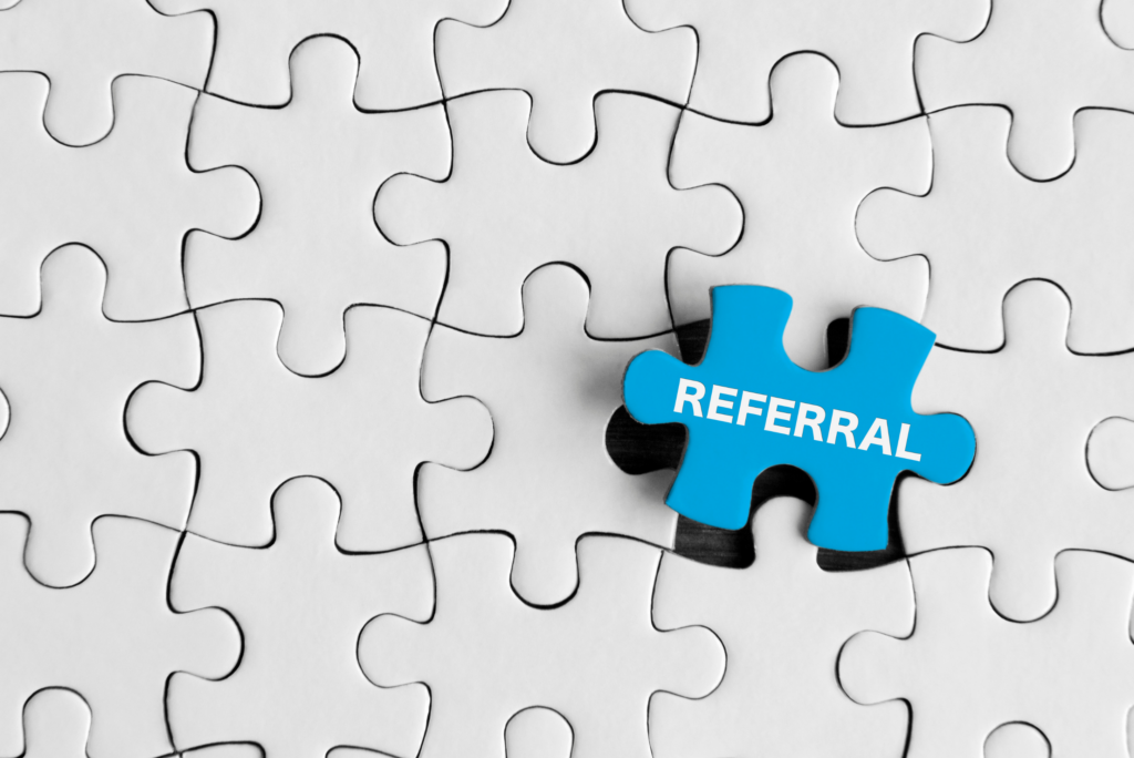 puzzle piece with words referral written on it