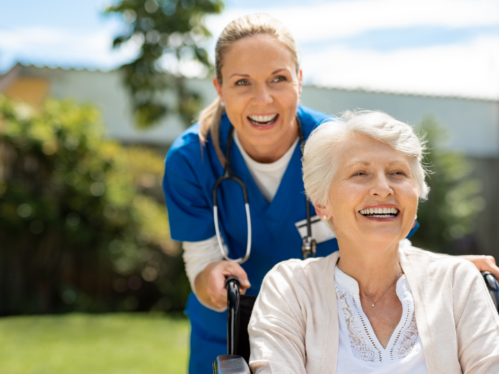 nurse pushing patient in wheelchair