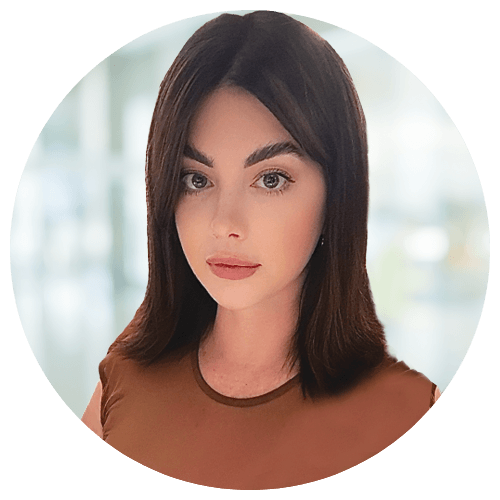 Jessica Williams, National Recruiter at Jackson Nurse Professionals, with straight dark brown hair in a brown top, looks at the camera with a neutral expression; blurred indoor background.