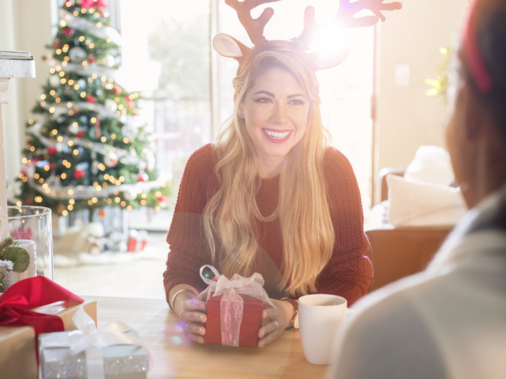 woman smiling holding gift