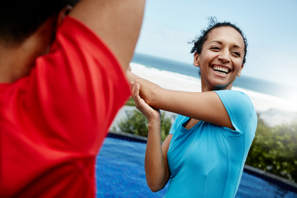 woman smiling and exercising