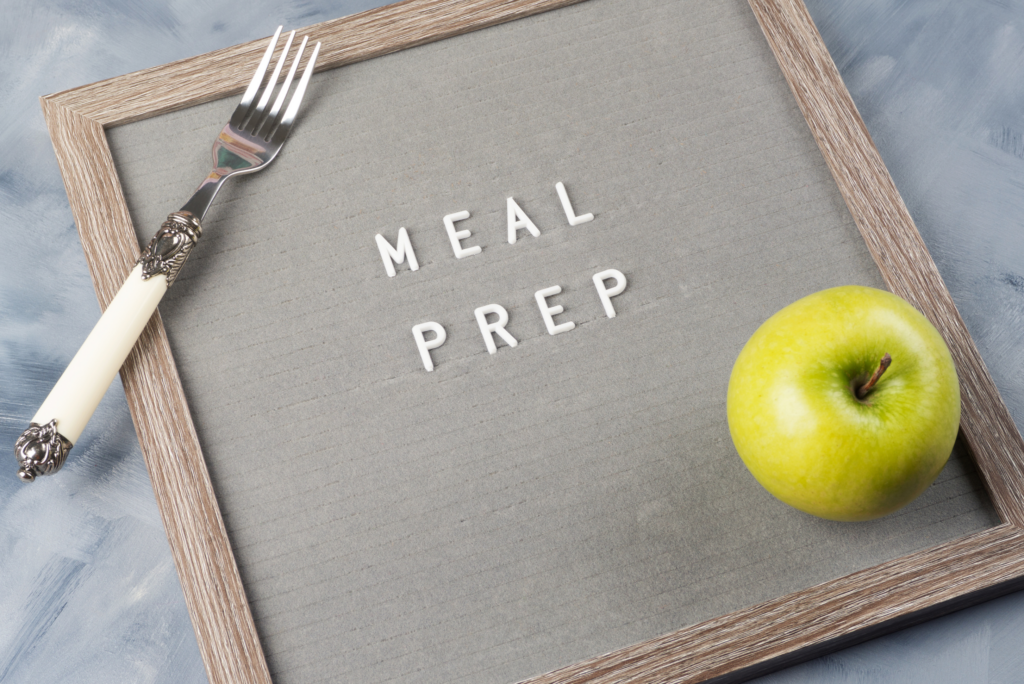 a sign that has the words meal prep on it with a fork and apple