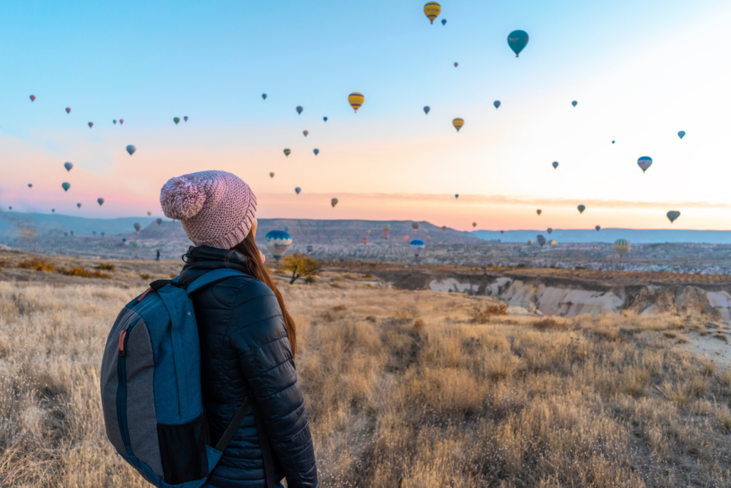 travel nurse looking at hot air balloons