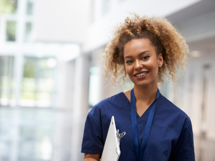 happy travel nurse in hospital