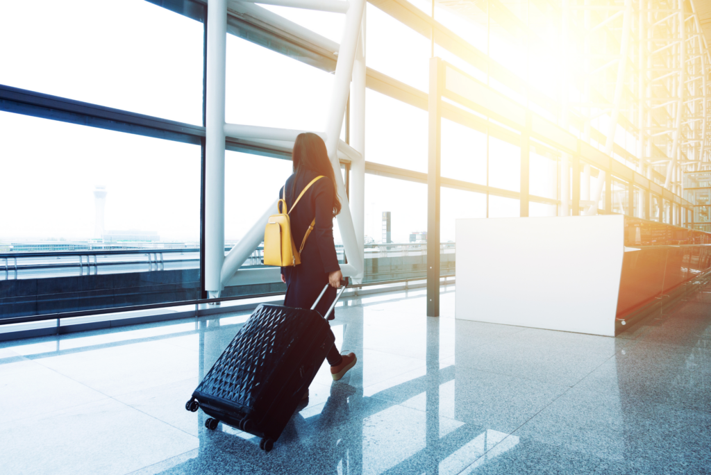 travel nurse dragging a rolling suticase