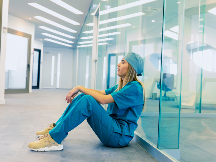 travel nurse sitting on floor