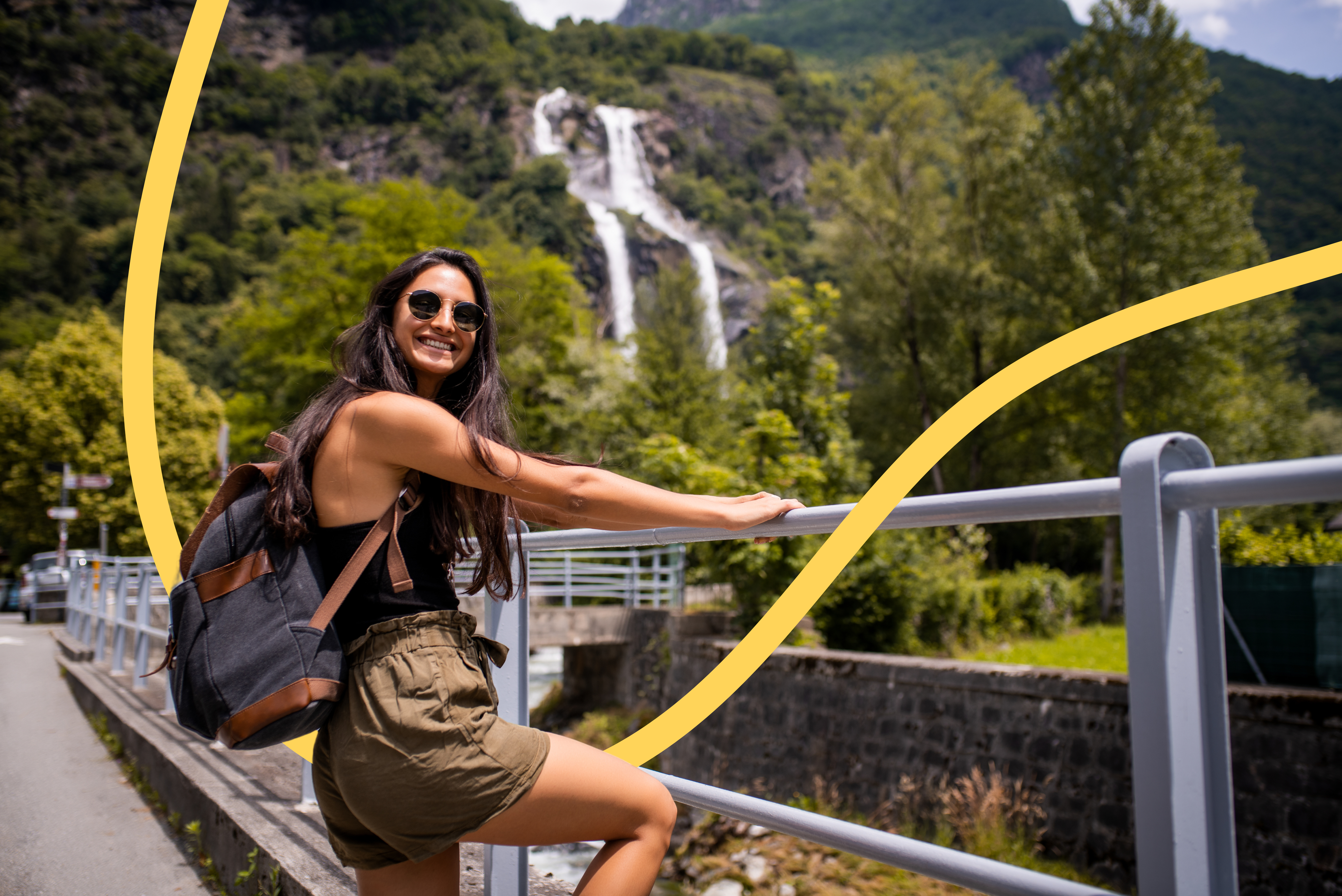 young woman hands on a rail next to a stream