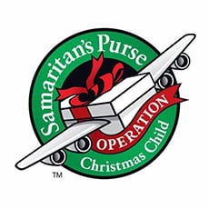 Logo for Samaritans Purse Operation Christmas Child, featuring a gift box with a red bow on an airplane, symbolizing giving back and community impact, encircled by green and red text.
